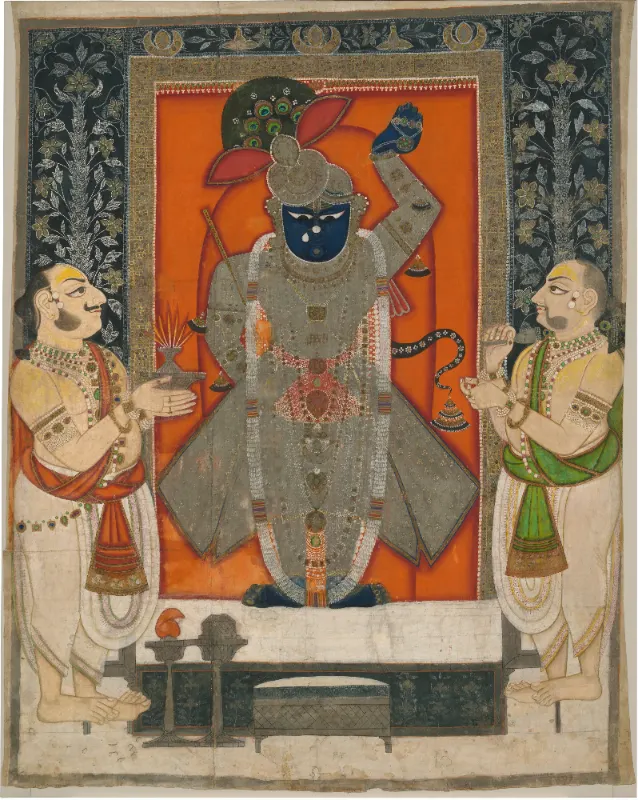 Priests worshipping Krishna as Shrinathji for Mountain of Food festival (Annakuta utsava)